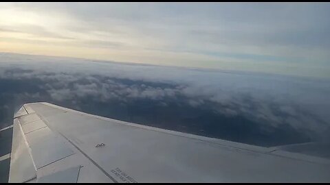 Taking off from Gatwick Airport at sunrise. Wing view of runway.