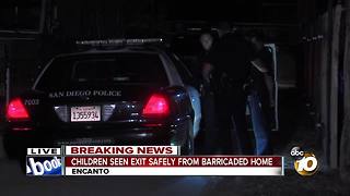 Children seen exiting from barricaded home