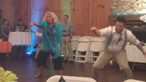 Mother and son deliver epic surprise wedding dance