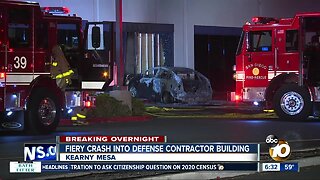 Car crashes into defense contractor building, bursts into flames