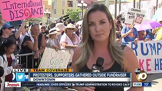 Protesters and supporters gather outside fundraiser