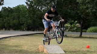 Man fails bicycle jump in style