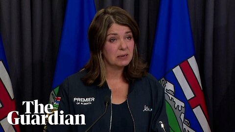 Alberta premier holds back tears as wildfire rages in western Canada