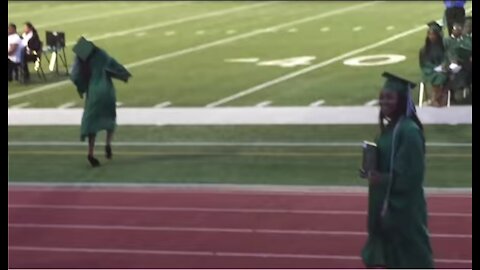 Girl doesn't know how to walk in high heels at her graduation