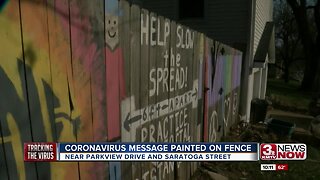 Coronavirus message painted on fence