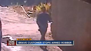Man disarms robber, holds him until authorities arrive