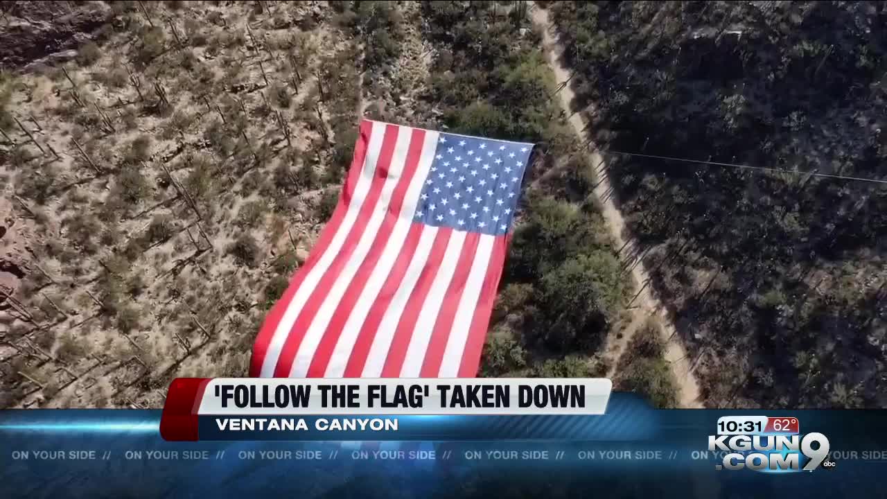 Follow the Flag lowers hanging flag in Ventana Canyon