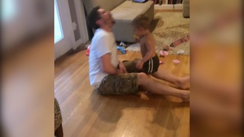 "A Tot Boy Kicks His Dad In The Groin"
