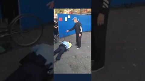 CCP Police Officer Pretends to Fall after Man Complains