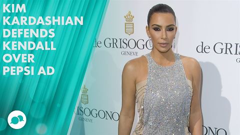 Kim Kardashian gets grilled, handles it like a pro