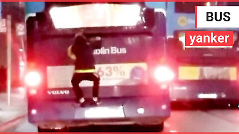 Shocking moment 'irresponsible' teen jumps onto back of MOVING double decker bus