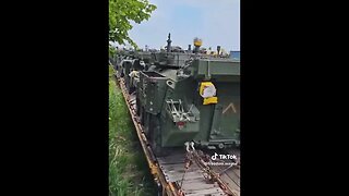 Video of a train full of military armor and other equipment, has moved into Montreal, Quebec.