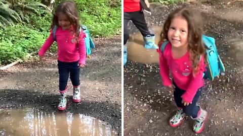 Little Girl Tries To Jump Over Puddle, Adorably Fails