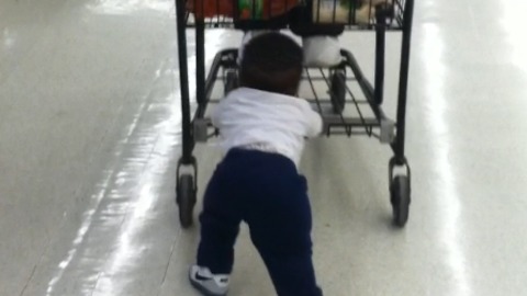 Toddler Pushes His Dad In A Shopping Cart