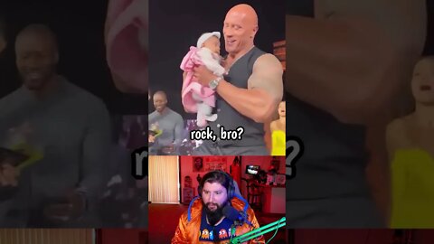 A baby goes crowd surfing to The Rock