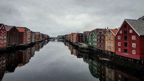 View from Gamle Bybru with rain over the colorful buildings along the Nidelva river in Trondheim