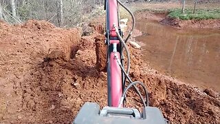 Harbor Freight Trencher, repairing the pond dam.