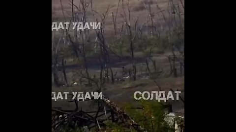 Ukrainian solider try to hit a Russian drone by swinging his rifle…