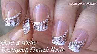 Gold & white side French manicure: Elegant drag marble nail art by toothpick