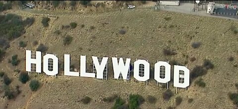 6 arrested after defacing Hollywood sign to bring awareness to breast cancer