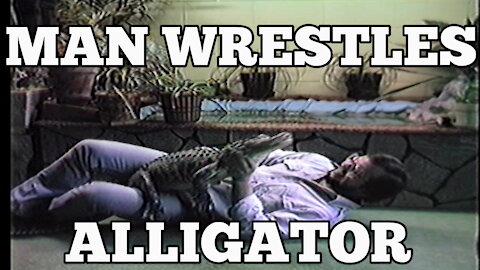 MAN WRESTLES ALLIGATOR