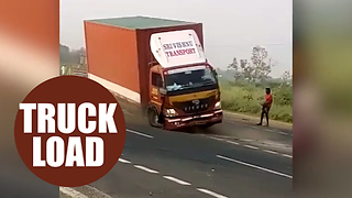 A driver was almost run over by his own truck - after it got stuck in reverse on the motorway.
