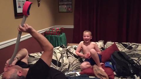 Boy Freaks Out After Dad Pretends To Swallow Sword