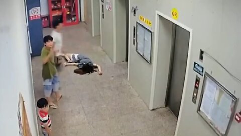 Chinese drunk man kicks lift violently_ trapping people in it