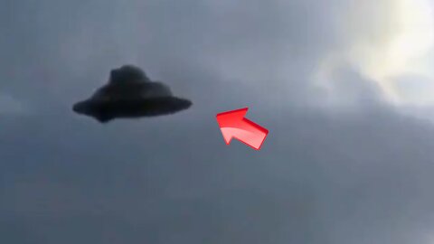 Sighting of a saucer-shaped UFO over a forest [Space]