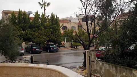 Rainfall on a quiet street in a residential area of Amman, Jordan