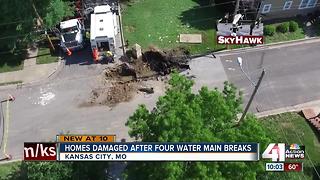 Water main break floods street near Plaza