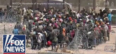 Watch hundred and migrants breach razor and rush the us border