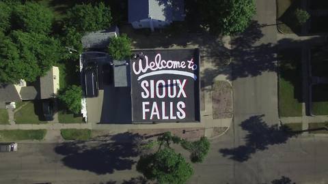 Sioux Falls citizen uses 1600 square foot roof to welcome visitors!