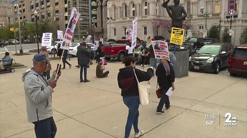 Community groups protest in front of city hall about ending food deserts