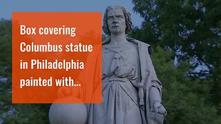 Box covering Columbus statue in Philadelphia painted with Italian flag colors