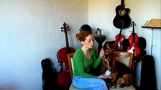 Basset Hound sings with her owner