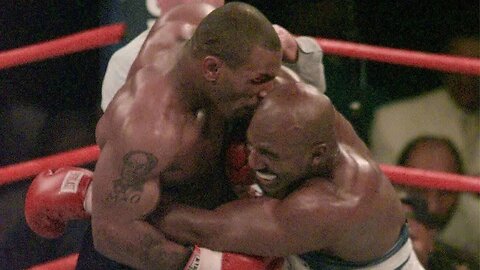 Mike Tyson tries Holyfield's ear again..