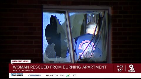 Firefighters rescue woman hanging from window of burning apartment building in North College Hill
