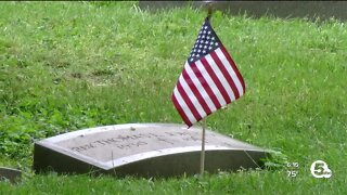 Volunteers begin process of placing 9,000 flags at Lake View Cemetery ahead of Memorial Day