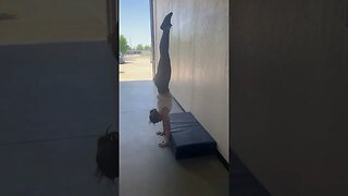 Forearm supported handstand