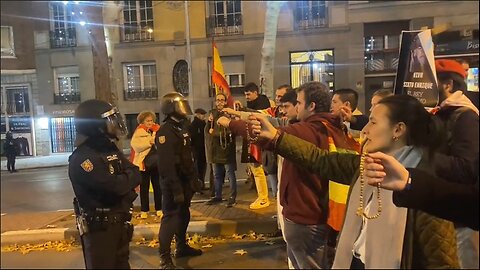 Spanish nationalists hold up their rosaries during protest against islam