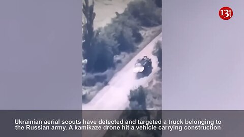 Russian soldiers fleeing from a truck carrying construction materials after it's struck by a drone