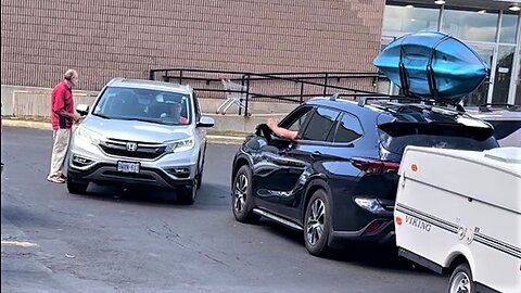 Stubborn lady & angry man face off in parking lot 'showdown'