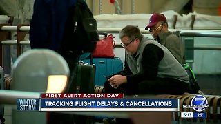 Hundreds of flights canceled as storm moves in