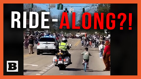 Ride-Along?! Louisiana Boy Cruises Alongside Cop in Mardi Gras Parade