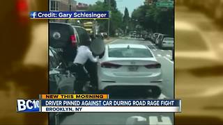 Driver pinned against car in road rage incident