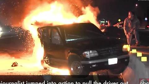 WATCH | Cameraman heroically pulls man from burning car