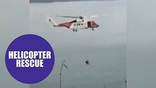 Incredible video shows Coastguard helicopter rescuing a teenager from the bottom of a 150ft cliff