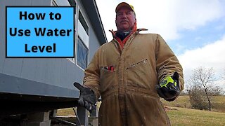 How to Use a Water Level to Re level A House