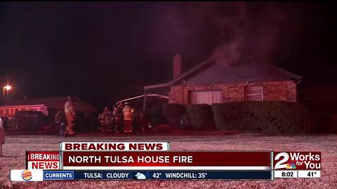 Firefighters battle house fire in North Tulsa